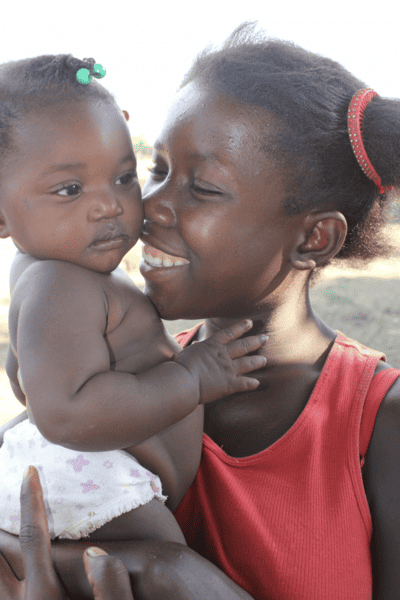 Holistic Haitian Alliance | children and family programs image of young Haitian woman and baby