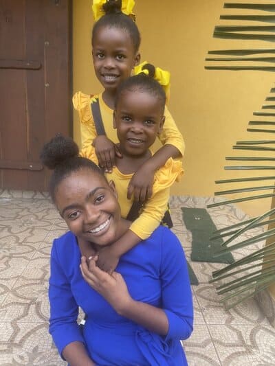 Holistic Haitian Alliance | children and family programs image of young Haitian woman and two children