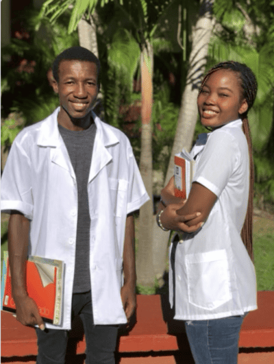 Holistic Haitian Alliance | children and family programs image of two Haitian Young Adults