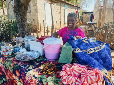 Holistic Haitian Alliance | community strengthening Haitian woman with wares