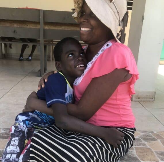 Holistic Haitian Alliance | trauma care is working Haitian house mother and child