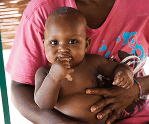 Holistic Haitian Alliance | Children & Family smiling Haitian baby
