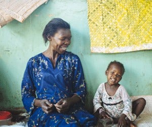 Holistic Haitian Alliance | Haitian happy woman and child