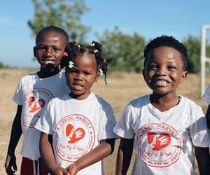 Holistic Haitian Alliance | education 2 smiling young Haitian students