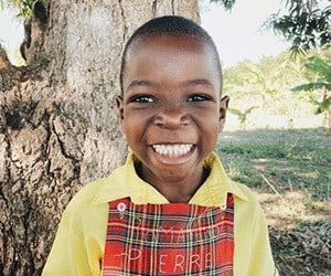 Holistic Haitian Alliance | education 4 young smiling Haitian student