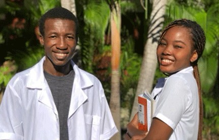 Holistic Haitian Alliance | get involved cta medical school fund two Haitian medical students with books