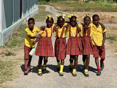 Holistic Haitian Alliance | Student Sponsorships smiling young Haitian students
